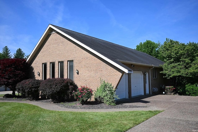 1029 S University Dr, Jasper, IN 47546 - view of side of property featuring brick siding and a garage
