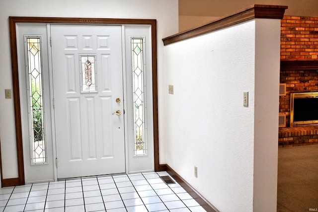 1029 S University Dr, Jasper, IN 47546 - foyer featuring baseboards and a brick fireplace