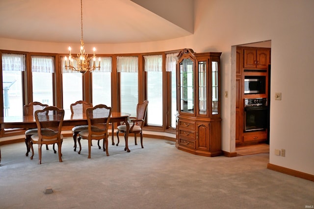 1029 S University Dr, Jasper, IN 47546 - dining space featuring light carpet, healthy amount of natural light, a chandelier, baseboards, and high vaulted ceiling