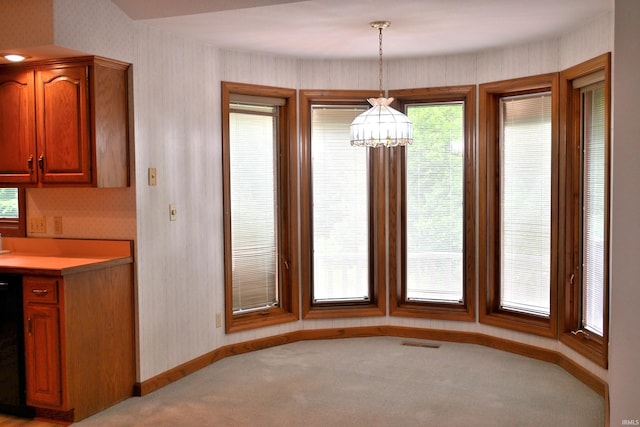 1029 S University Dr, Jasper, IN 47546 - unfurnished dining area featuring a chandelier, light colored carpet, and baseboards
