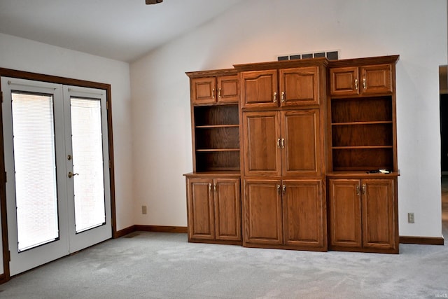 1029 S University Dr, Jasper, IN 47546 - interior space featuring french doors, lofted ceiling, light carpet, baseboards, and a ceiling fan