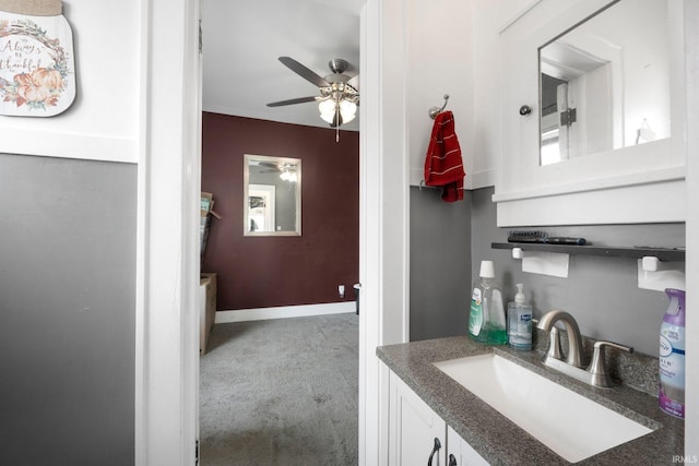 285 N Center St, Waterloo, IN 46793 - bathroom featuring a ceiling fan, vanity, and baseboards