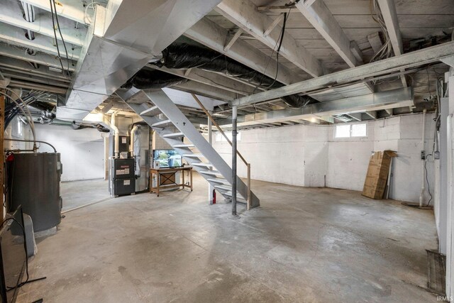 285 N Center St, Waterloo, IN 46793 - basement with water heater, stairway, and heating unit