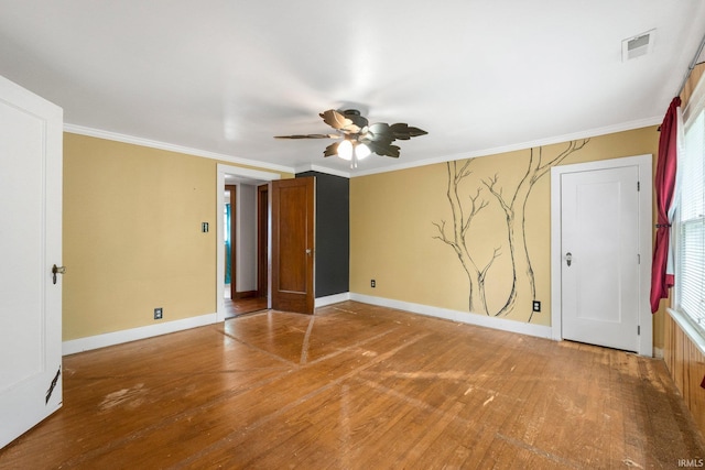 285 N Center St, Waterloo, IN 46793 - unfurnished bedroom with wood finished floors, baseboards, ornamental molding, and a ceiling fan