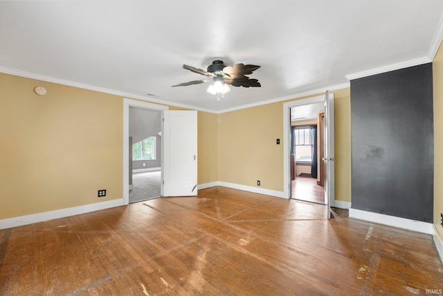 285 N Center St, Waterloo, IN 46793 - unfurnished room featuring healthy amount of natural light, wood-type flooring, ceiling fan, baseboards, and ornamental molding