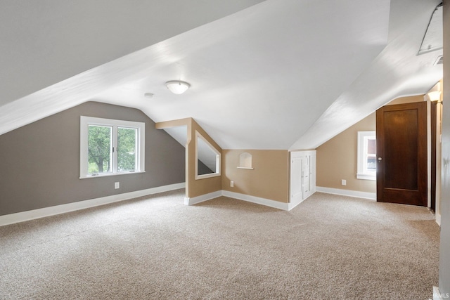 285 N Center St, Waterloo, IN 46793 - additional living space featuring lofted ceiling, light carpet, and baseboards