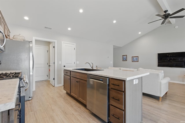 3436 Fawn Creek Blvd, Waterloo, IN 46793 - kitchen with appliances with stainless steel finishes, a sink, vaulted ceiling, ceiling fan, and a kitchen island with sink