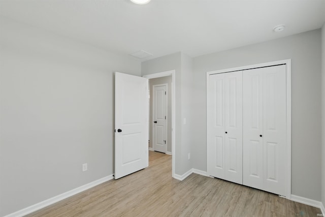 3436 Fawn Creek Blvd, Waterloo, IN 46793 - unfurnished bedroom with light wood-style floors, baseboards, and a closet