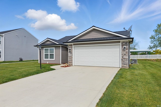 3436 Fawn Creek Blvd, Waterloo, IN 46793 - ranch-style home with stone siding, driveway, cooling unit, an attached garage, and roof with shingles