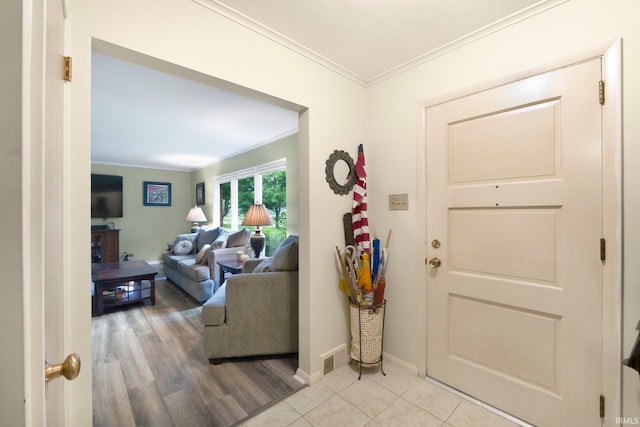 4112 Hiawatha Blvd, Fort Wayne, IN 46809 - foyer entrance with ornamental molding, light wood-style flooring, and baseboards