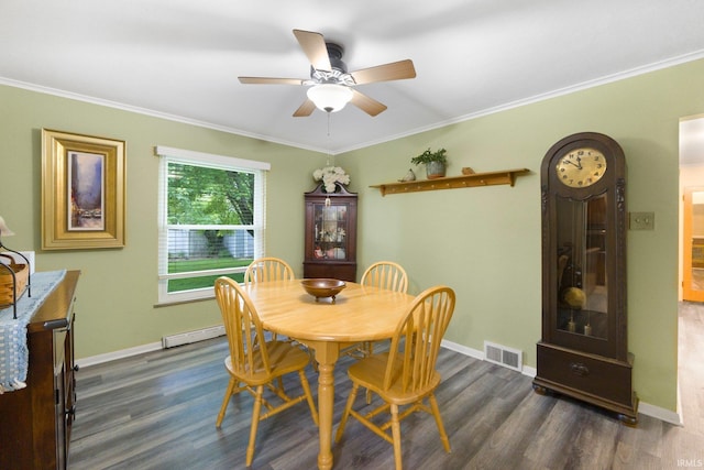 4112 Hiawatha Blvd, Fort Wayne, IN 46809 - dining area featuring baseboard heating, baseboards, a ceiling fan, dark wood-style flooring, and crown molding