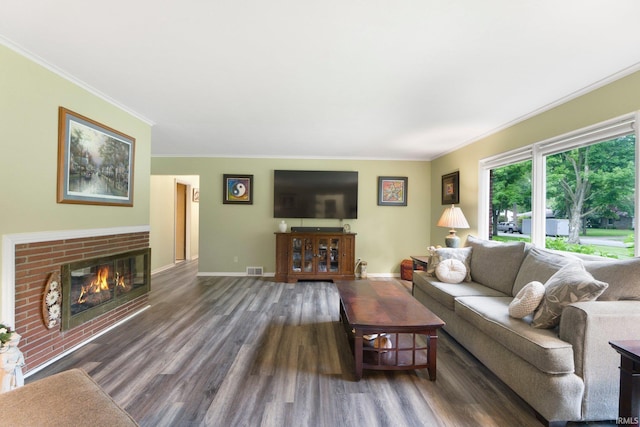 4112 Hiawatha Blvd, Fort Wayne, IN 46809 - living area with ornamental molding, wood finished floors, a fireplace, and baseboards
