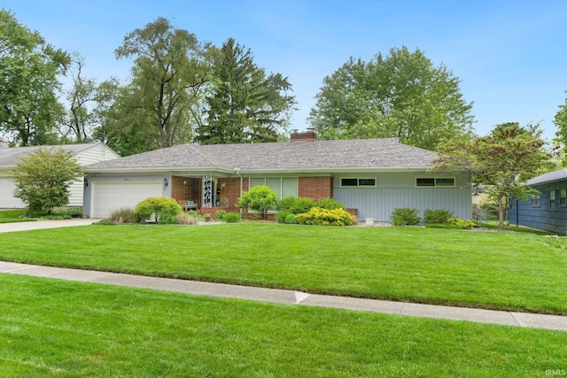 4112 Hiawatha Blvd, Fort Wayne, IN 46809 - ranch-style house featuring a garage, a chimney, a front yard, and driveway