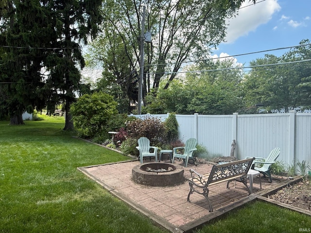 4112 Hiawatha Blvd, Fort Wayne, IN 46809 - view of yard featuring an outdoor fire pit and a patio