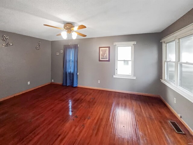 2550 N Kentucky Ave, Evansville, IN 47711 - empty room featuring wood finished floors, ceiling fan, and baseboards