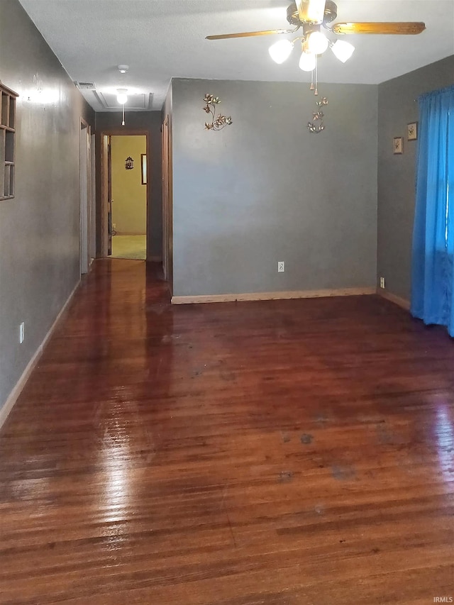 2550 N Kentucky Ave, Evansville, IN 47711 - empty room with a ceiling fan, wood finished floors, attic access, and baseboards