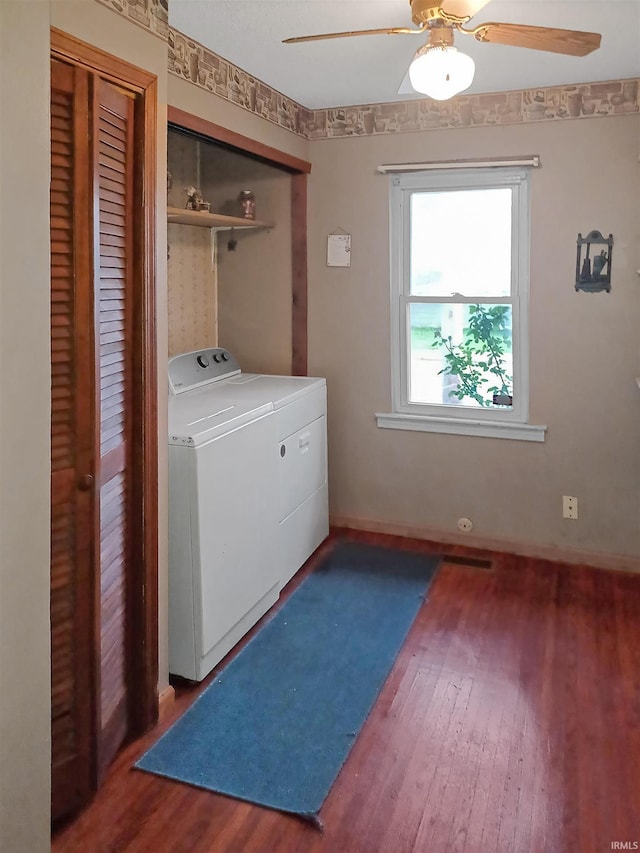 2550 N Kentucky Ave, Evansville, IN 47711 - washroom with washer and clothes dryer, wood finished floors, a ceiling fan, and baseboards