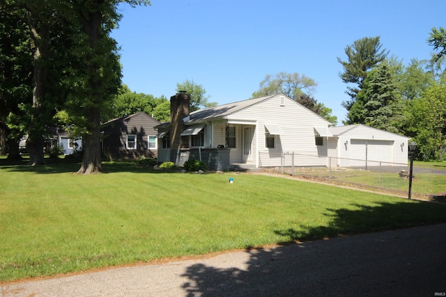 19511 Eaton Ave, South Bend, IN 46637 - ranch-style home featuring a chimney, a garage, and driveway