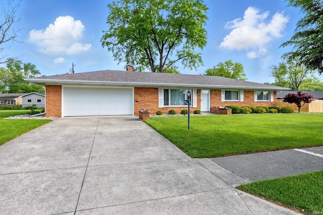 928 Hollyhill Dr, Fort Wayne, IN 46819 - ranch-style house with a garage, concrete driveway, a front yard, brick siding, and a chimney