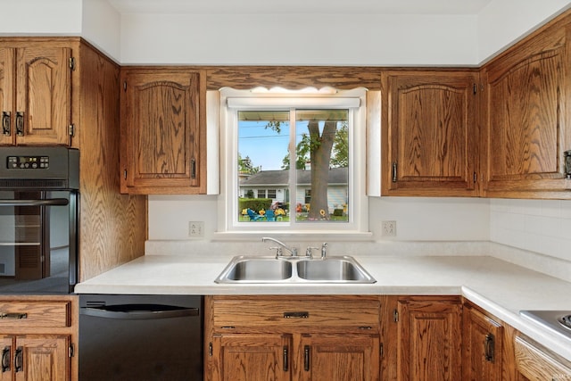 928 Hollyhill Dr, Fort Wayne, IN 46819 - kitchen with dishwashing machine, oven, a sink, and light countertops