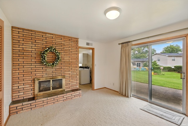 928 Hollyhill Dr, Fort Wayne, IN 46819 - unfurnished living room featuring washer / dryer, a fireplace, carpet flooring, and baseboards