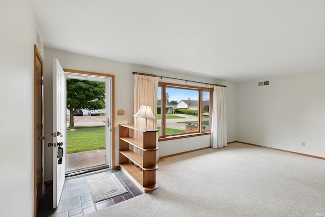 928 Hollyhill Dr, Fort Wayne, IN 46819 - entryway featuring baseboards and carpet