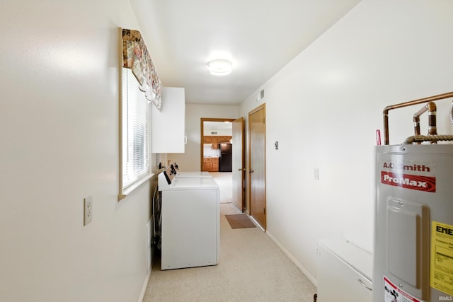928 Hollyhill Dr, Fort Wayne, IN 46819 - laundry area with washing machine and clothes dryer, water heater, baseboards, and light carpet