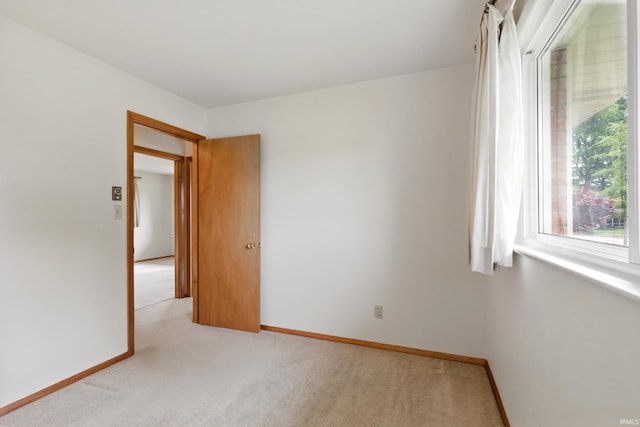 928 Hollyhill Dr, Fort Wayne, IN 46819 - empty room featuring light carpet and baseboards