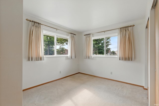 928 Hollyhill Dr, Fort Wayne, IN 46819 - spare room with plenty of natural light, carpet flooring, and baseboards