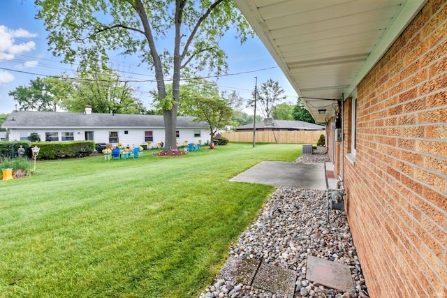 928 Hollyhill Dr, Fort Wayne, IN 46819 - view of yard featuring a patio