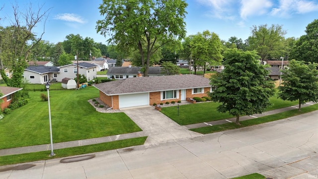 928 Hollyhill Dr, Fort Wayne, IN 46819 - ranch-style house with brick siding, a residential view, a front yard, concrete driveway, and an attached garage