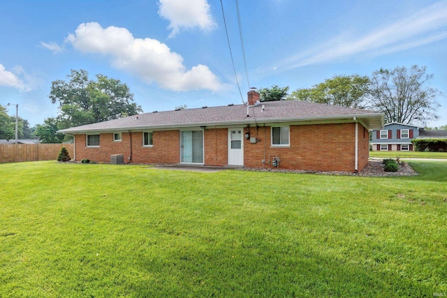 928 Hollyhill Dr, Fort Wayne, IN 46819 - rear view of house with brick siding and a chimney