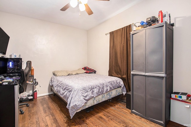 402 W Waterford St, Wakarusa, IN 46573 - bedroom with wood finished floors, a ceiling fan, and baseboards