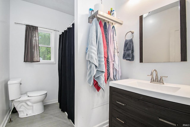 402 W Waterford St, Wakarusa, IN 46573 - full bath with baseboards, toilet, vanity, and curtained shower