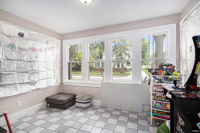 402 W Waterford St, Wakarusa, IN 46573 - sunroom with baseboards and tile patterned floors