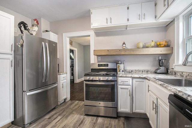 402 W Waterford St, Wakarusa, IN 46573 - kitchen with stainless steel appliances, open shelves, white cabinets, and a sink