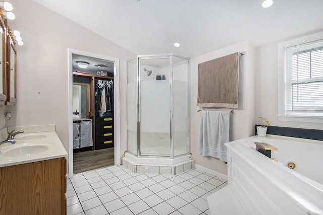 402 W Waterford St, Wakarusa, IN 46573 - bathroom with a stall shower, tile patterned flooring, double vanity, a whirlpool tub, and recessed lighting