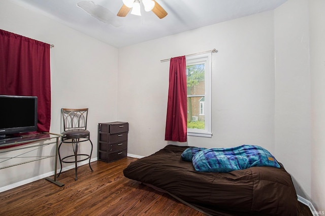 402 W Waterford St, Wakarusa, IN 46573 - bedroom with wood finished floors, baseboards, and a ceiling fan