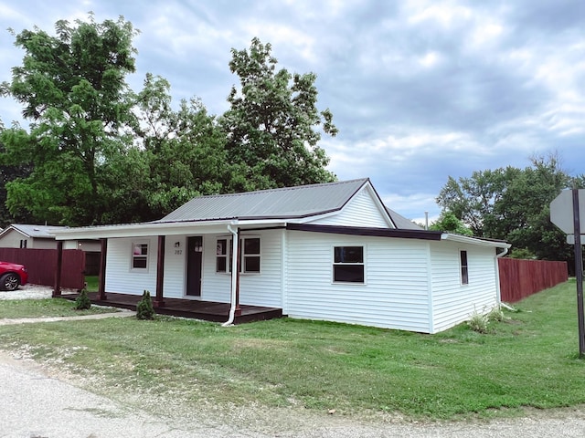 202 E Vine St, Mitchell, IN 47446 - ranch-style house with covered porch and metal roof