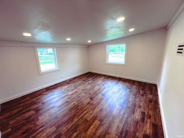 202 E Vine St, Mitchell, IN 47446 - empty room featuring dark wood finished floors, recessed lighting, and baseboards