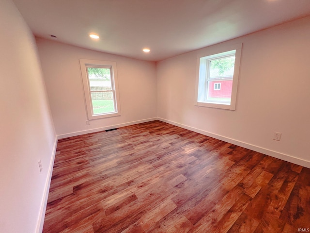 202 E Vine St, Mitchell, IN 47446 - spare room with plenty of natural light, wood finished floors, baseboards, and recessed lighting