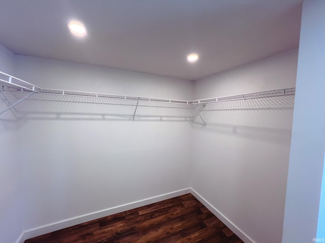 202 E Vine St, Mitchell, IN 47446 - spacious closet featuring dark wood-style flooring