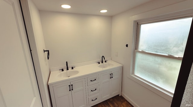202 E Vine St, Mitchell, IN 47446 - bathroom featuring wood finished floors, recessed lighting, double vanity, and baseboards
