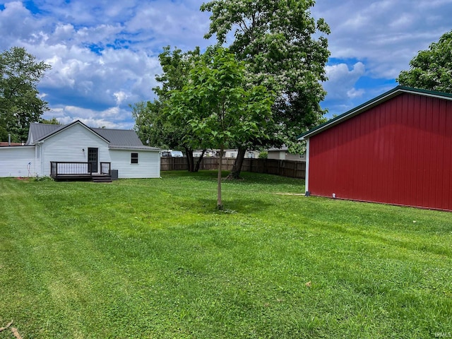202 E Vine St, Mitchell, IN 47446 - view of yard with a deck and an outbuilding