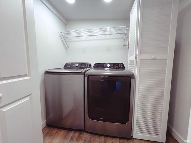 202 E Vine St, Mitchell, IN 47446 - laundry area with washer and clothes dryer, wood finished floors, and baseboards