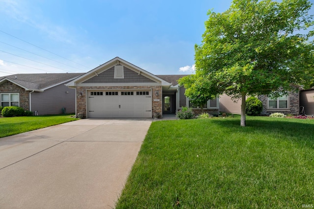 354 Kettle Cir, Lafayette, IN 47905 - view of front of property with a garage, a front yard, concrete driveway, and stone siding