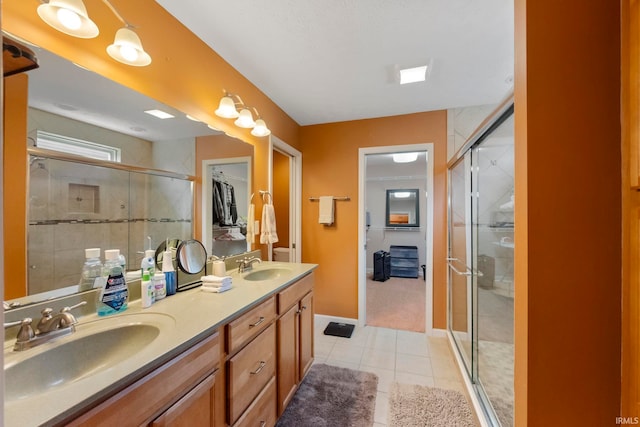 354 Kettle Cir, Lafayette, IN 47905 - full bathroom featuring double vanity, a stall shower, tile patterned flooring, and baseboards