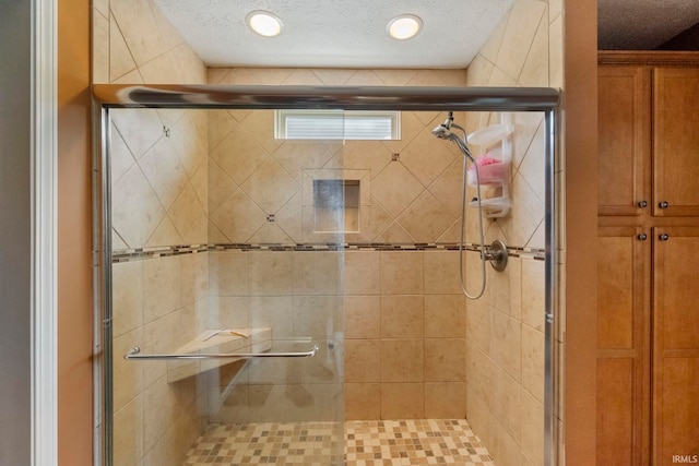 354 Kettle Cir, Lafayette, IN 47905 - bathroom featuring a stall shower and a textured ceiling