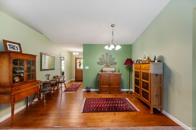 354 Kettle Cir, Lafayette, IN 47905 - dining space with a chandelier, hardwood / wood-style flooring, and baseboards