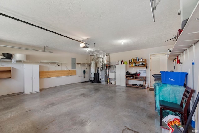 354 Kettle Cir, Lafayette, IN 47905 - garage featuring a garage door opener, a sink, and gas water heater